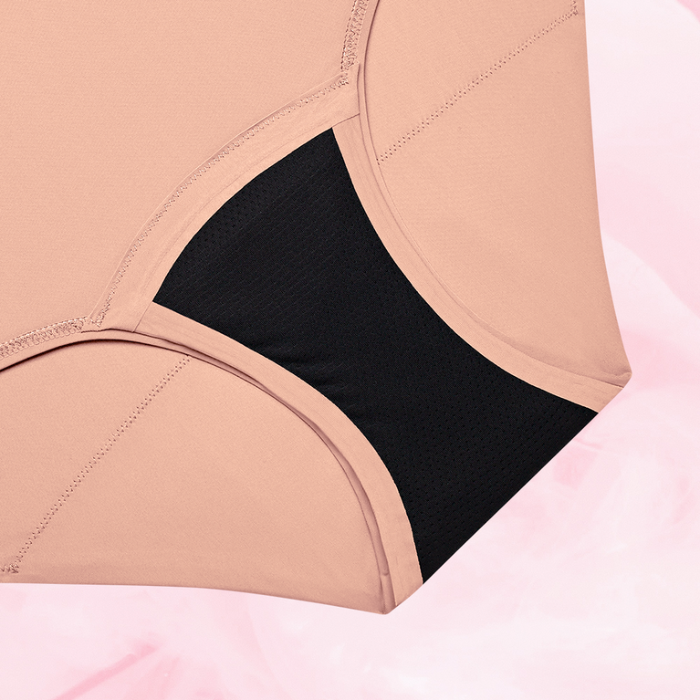 ComfortFit High Waist Heavy period pants with a close-up of the black and pink garment, showcasing the slimline edges and high waist design for optimal comfort.