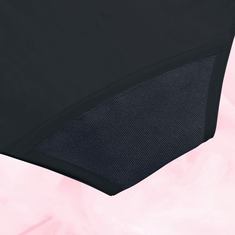 A close-up of the AltText.ai - High Waist Floral Moderate by intimawear by Bodyform™ shows a black garment with a textured mesh panel. The soft pastel pink background gently contrasts with the dark fabric, emphasizing the sustainable design.