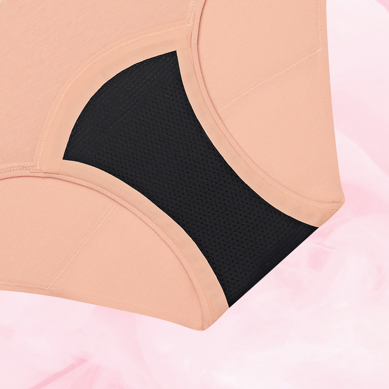 Close-up of ComfortFit Essentials Hipster Logo Waistband Heavy period pants, showcasing slimline edges and logo waistband designed for comfort and reliable protection.