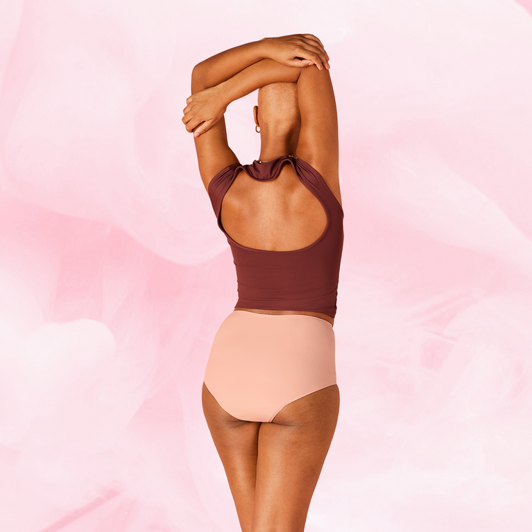 Woman wearing ComfortFit High Waist Heavy period pants, showcasing a supportive fit and discreet protection, designed for comfort and reliability during menstrual cycles.