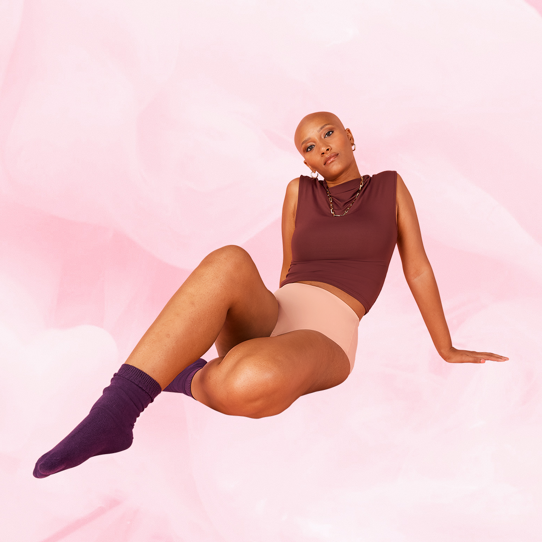 ComfortFit High Waist Moderate period pants showcased on a woman sitting, emphasizing their high waist design and sleek fit for reliable protection.