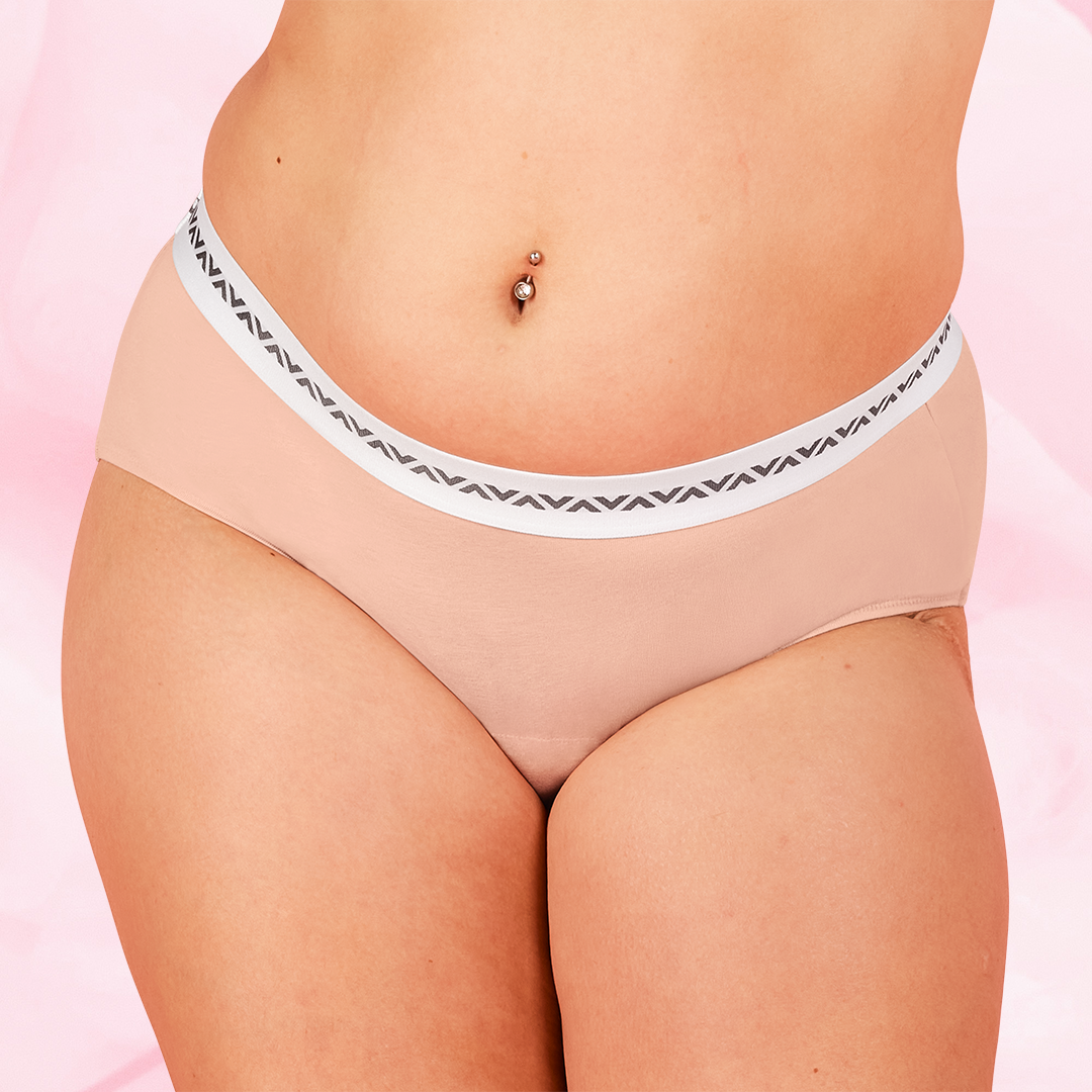 Woman wearing ComfortFit Essentials Hipster Logo Waistband Heavy period pants, highlighting close fit and discreet protection with innovative TriTech Performance technology for reliable, long-lasting comfort.