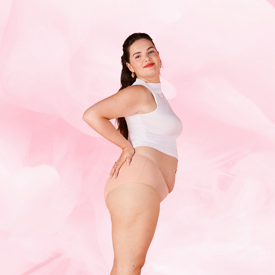 Woman wearing ComfortFit Essentials Hipster Light period pants, showcasing high waist design and slimline edges, emphasizing comfort and reliable protection.
