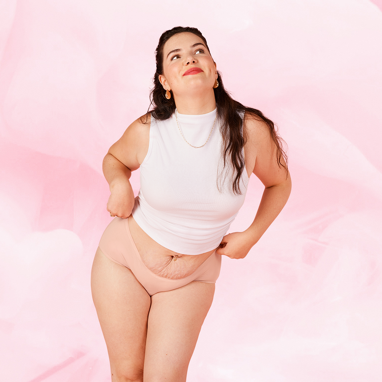 ComfortFit Essentials Hipster Light period pants showcased by a woman, highlighting the high waist, slimline edges, and soft fabric for reliable protection and comfort.